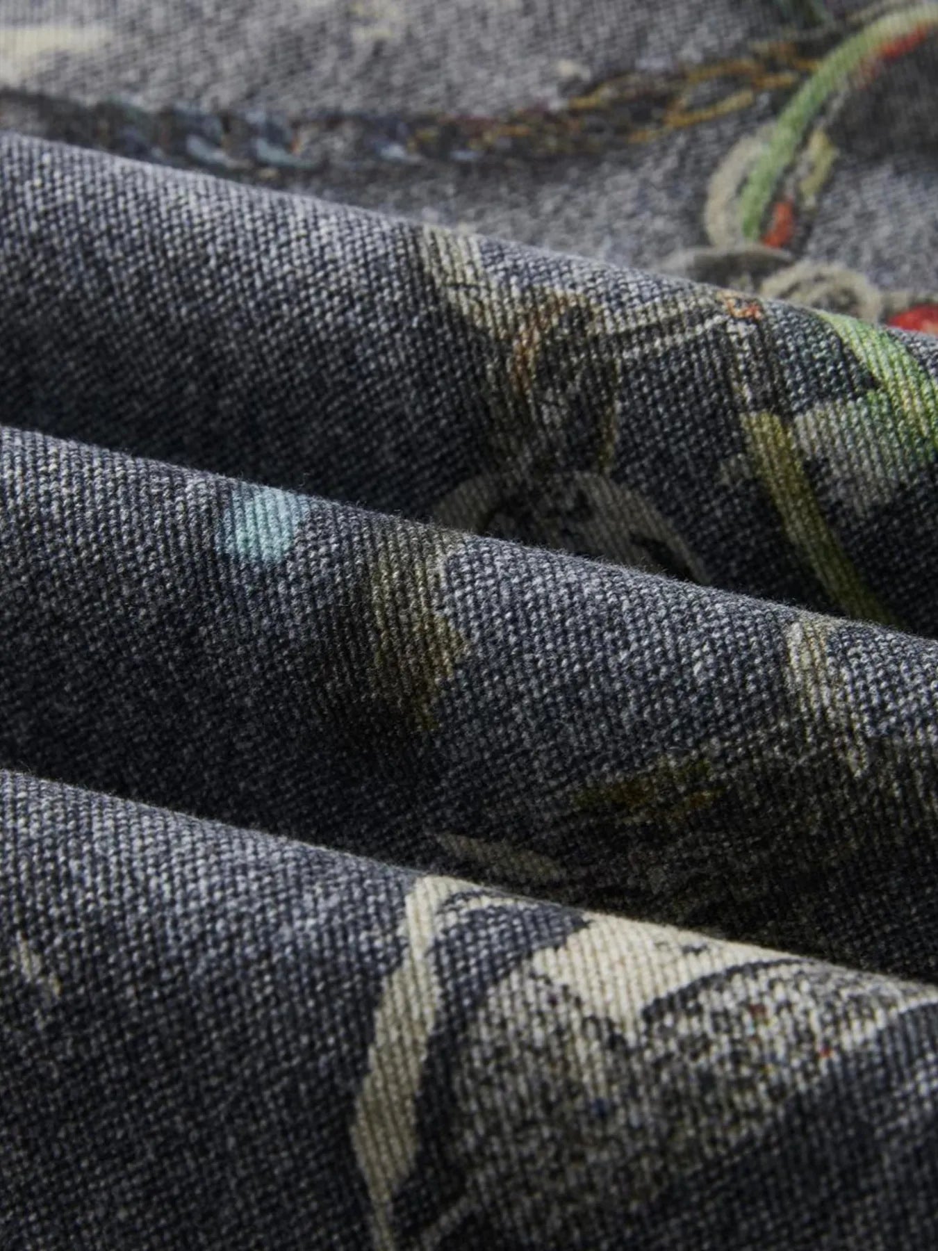  a pair of Modern Men's Distressed Printed Wide Leg Jeans fabric detail
