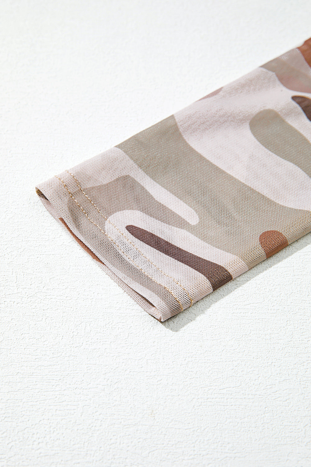 Folded fabric with abstract pattern on a white background