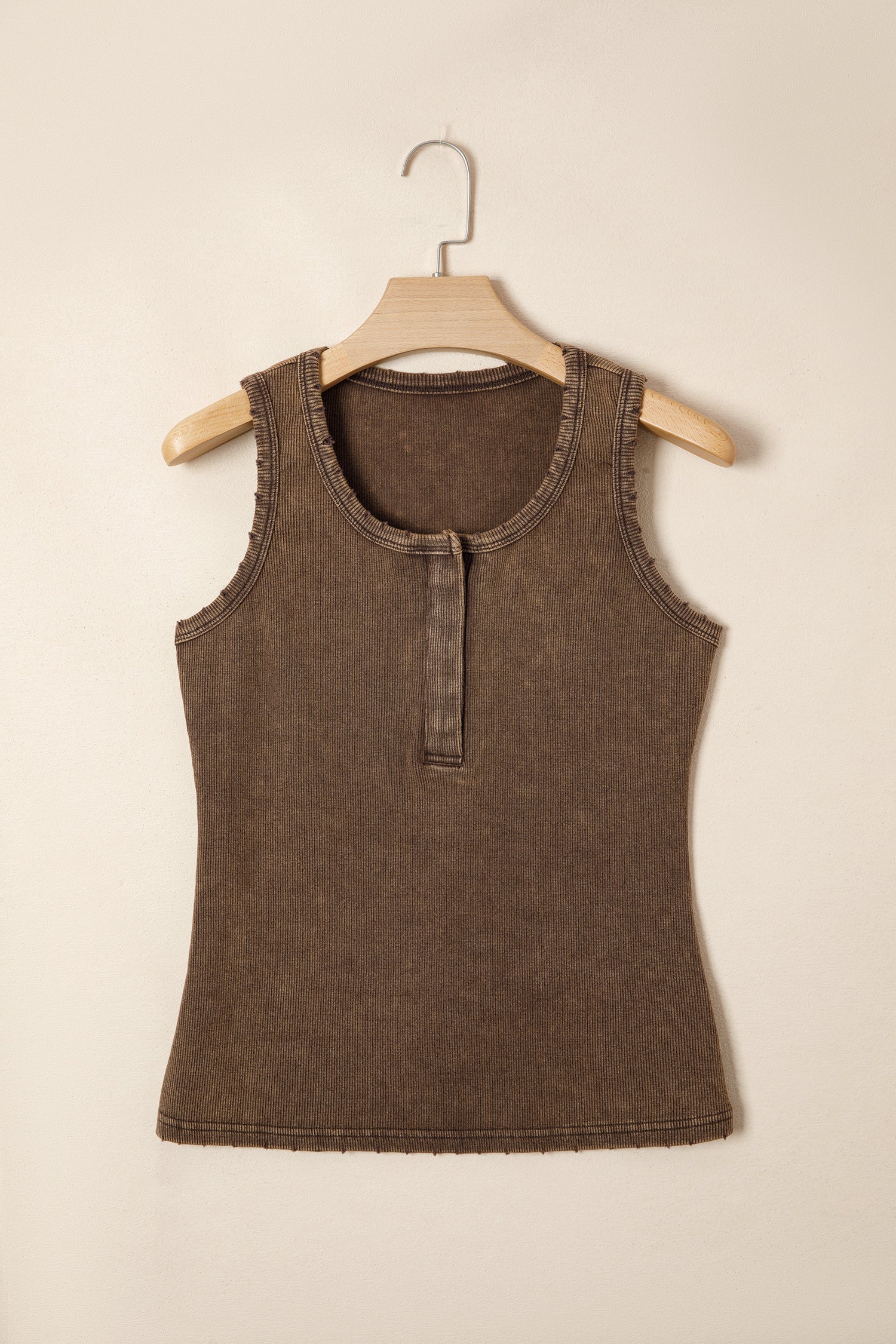 Brown tank top on a wooden hanger against a beige background front