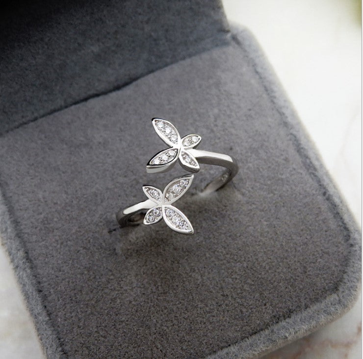 Fly into style with our Sterling Silver Open Butterfly Ring! Made with high-quality sterling silver, this ring features a playful and delicate butterfly design. Perfect for adding a touch of whimsy to any outfit. 