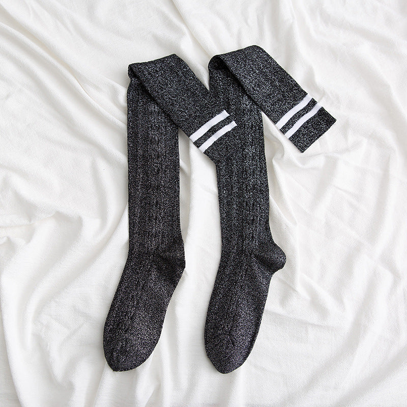 Pair of gray socks with white stripes on a white background