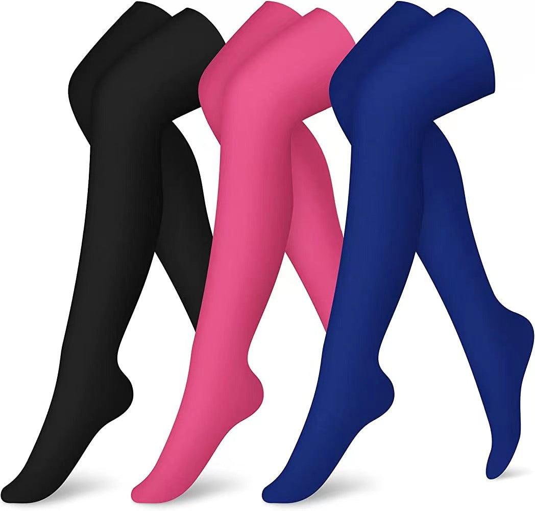 Black, pink, and blue tights on a white background