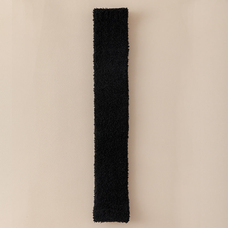 Black rectangular object on a beige background