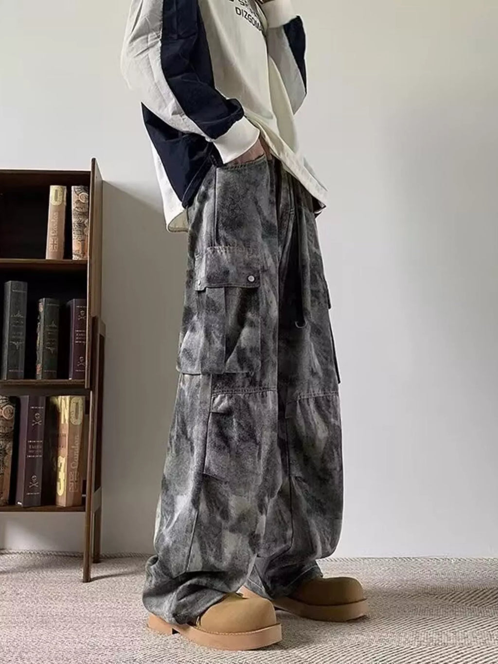 Model wearing black/grey Men's Tie-dye Loose Fit Cargo Jeans left side view