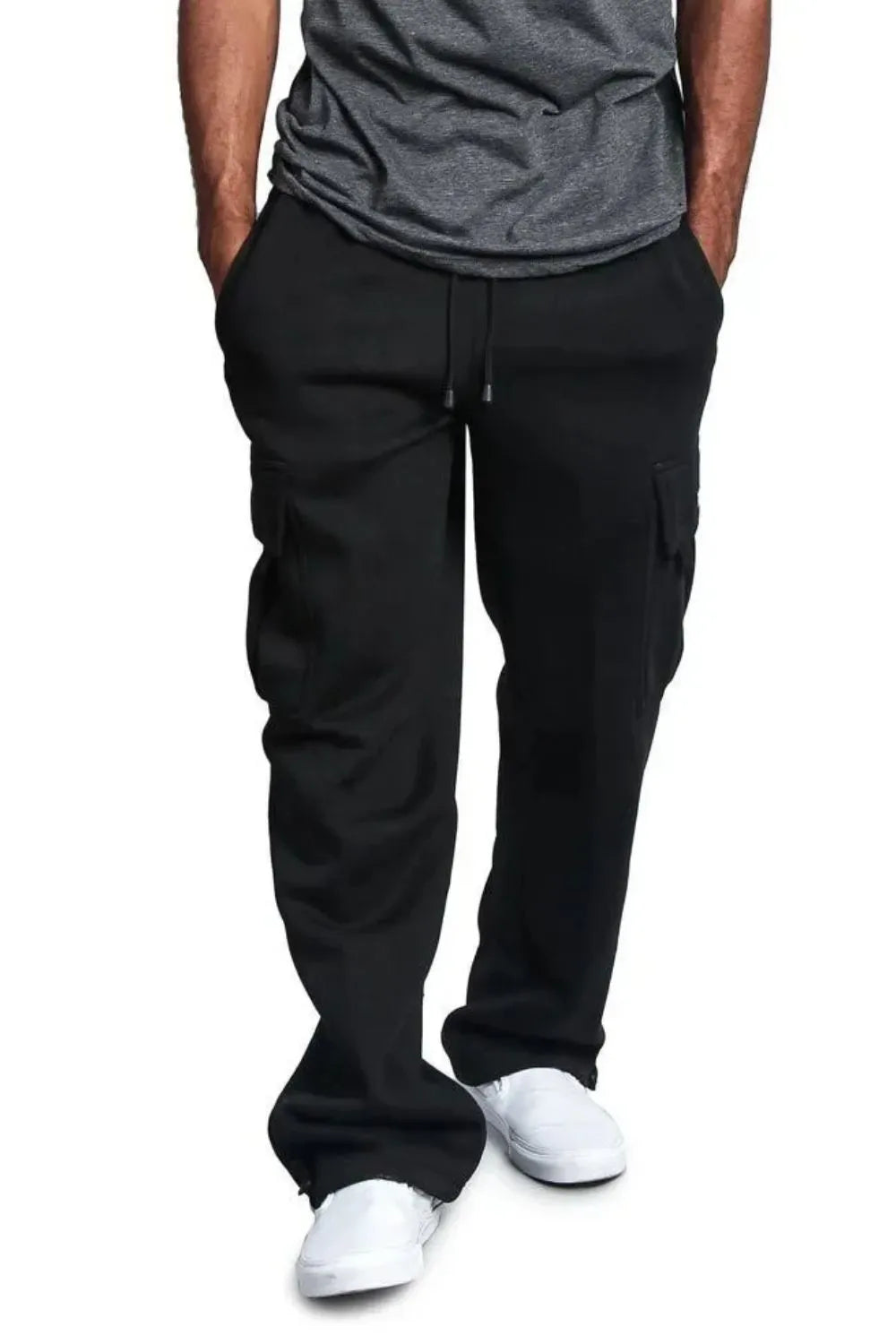 Male model wearing a pair of black casual draw string cargo joggers pants 