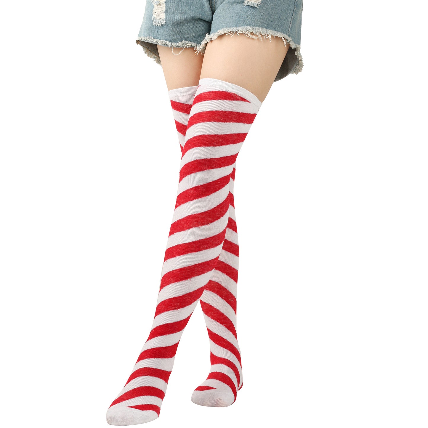 Red and white striped knee-high socks worn with denim shorts on a white background