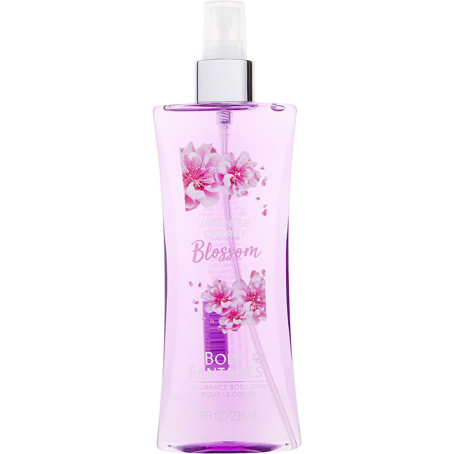 A bottle of Body Fantasies Japanese Cherry Blossom body spray with a pink and purple design, featuring an image of cherry blossoms.