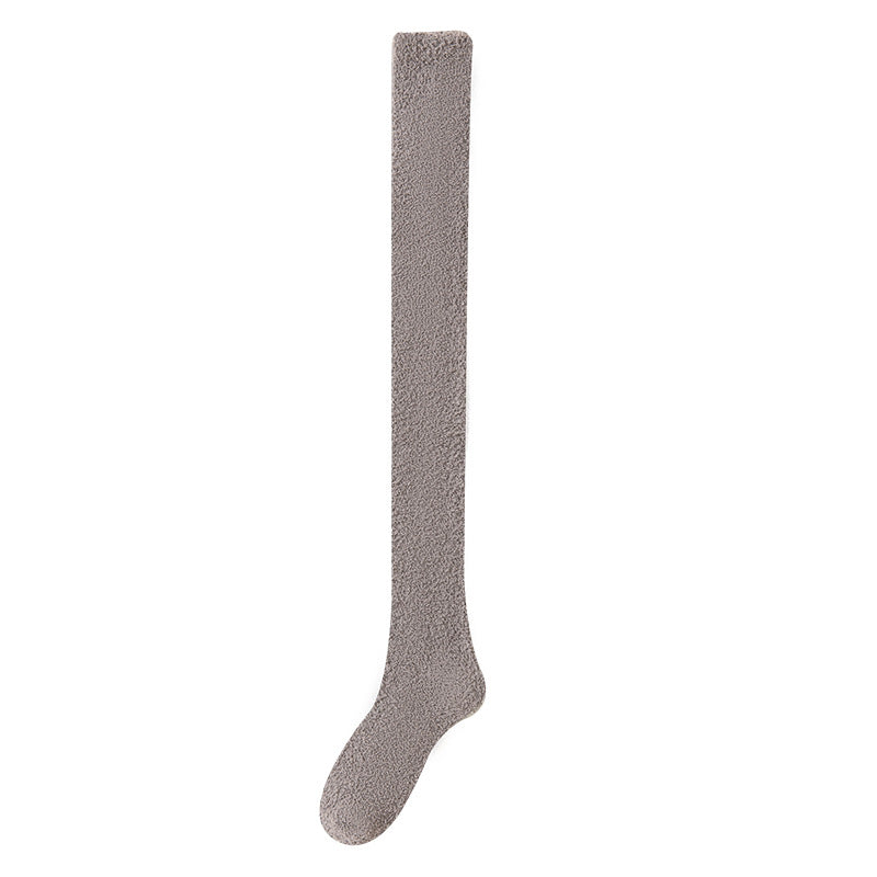 Gray knee-high sock on a white background