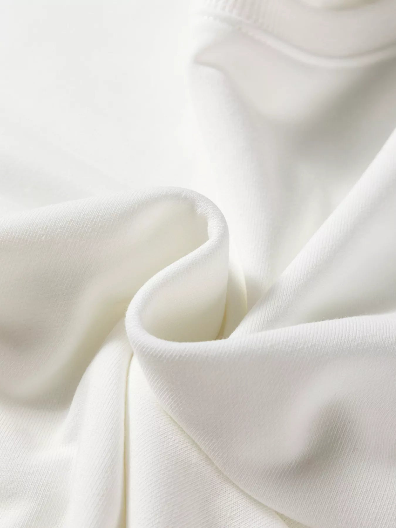 Close-up of white fabric with folds