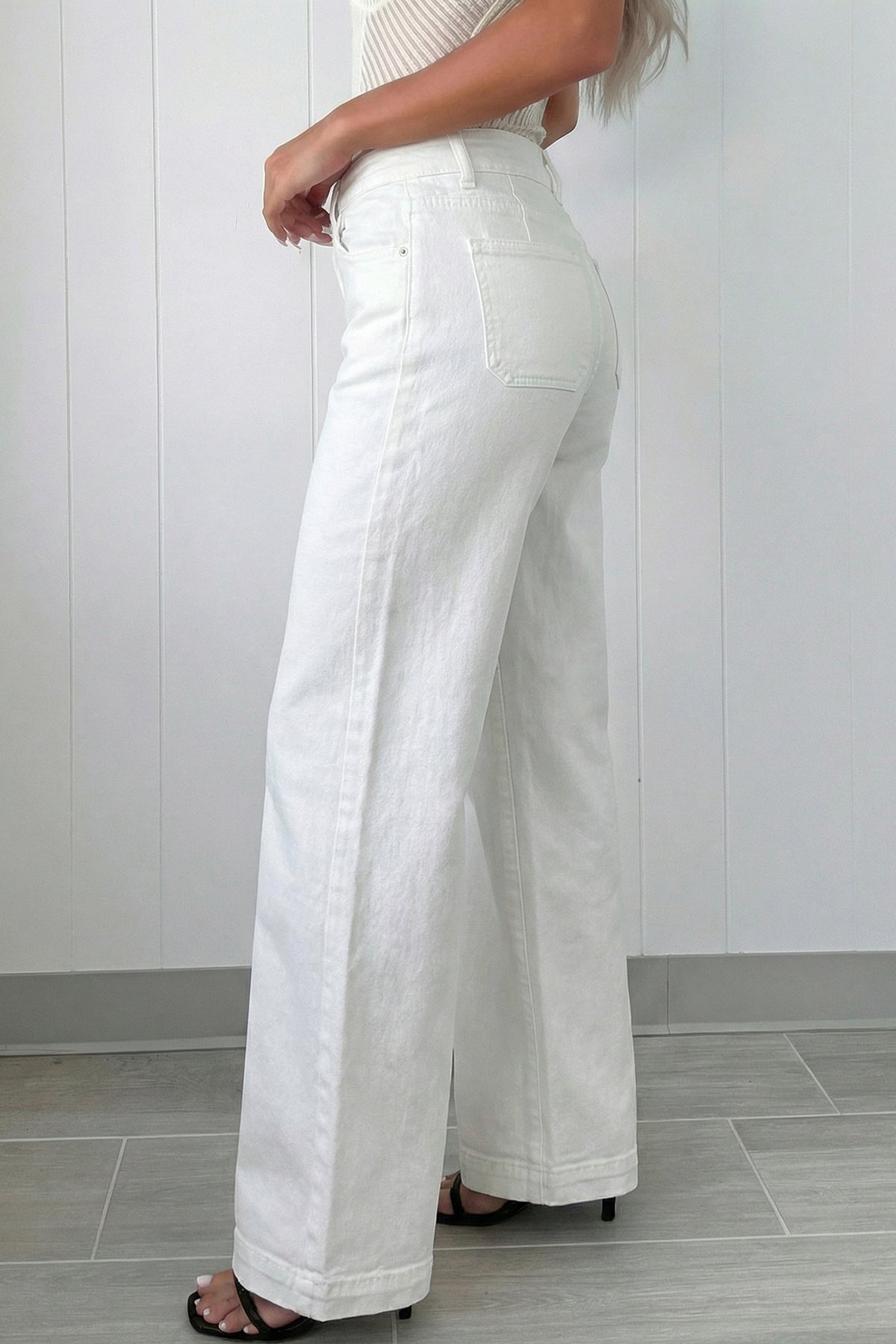 White  High Waist Wide Leg Jeans worn by a model side view