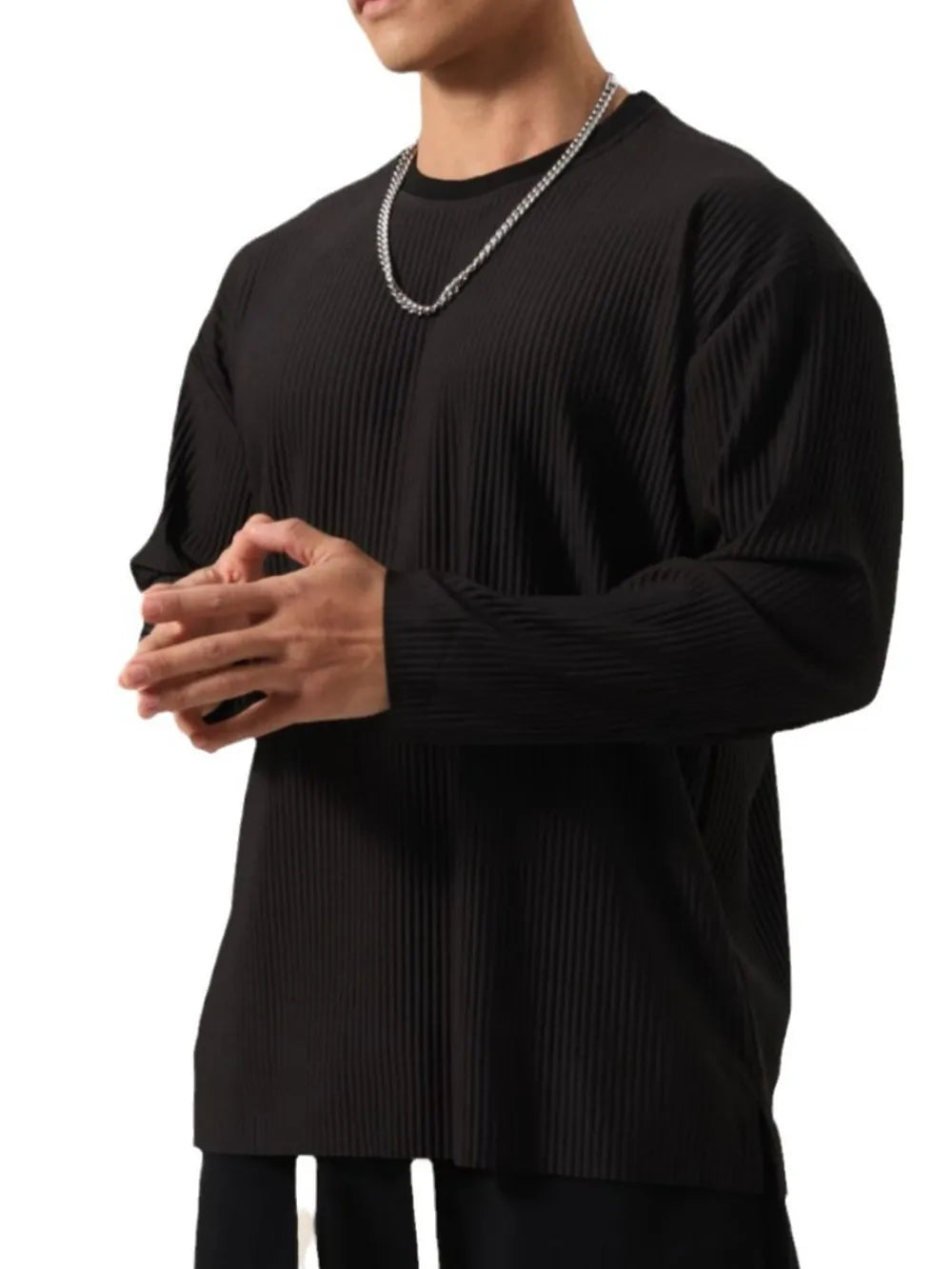 Person wearing a black Men's Basic Ribbed Round Neck Long Sleeve T-Shirt front view