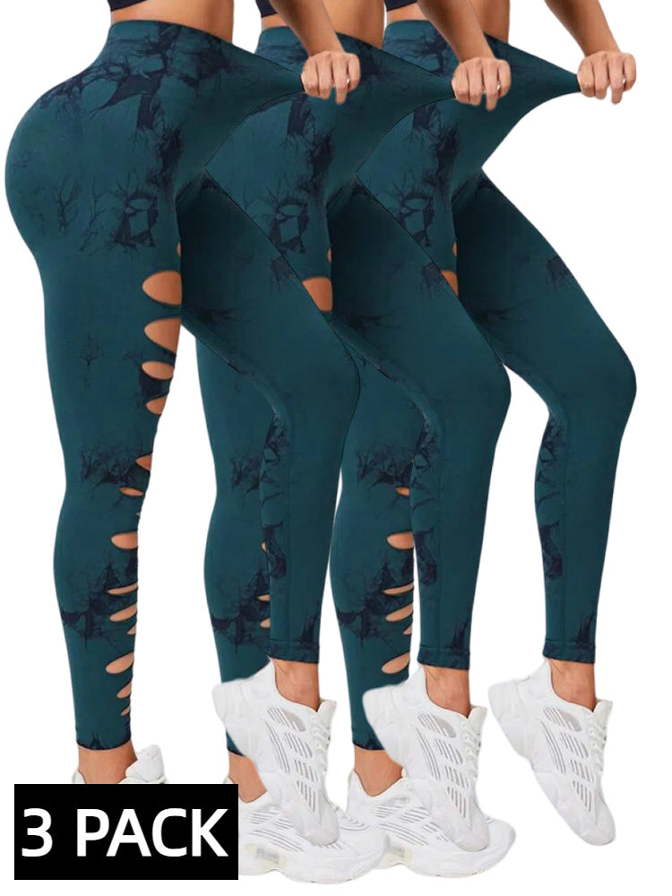 Three pairs of teal leggings with cut-out design and white sneakers on a white background.