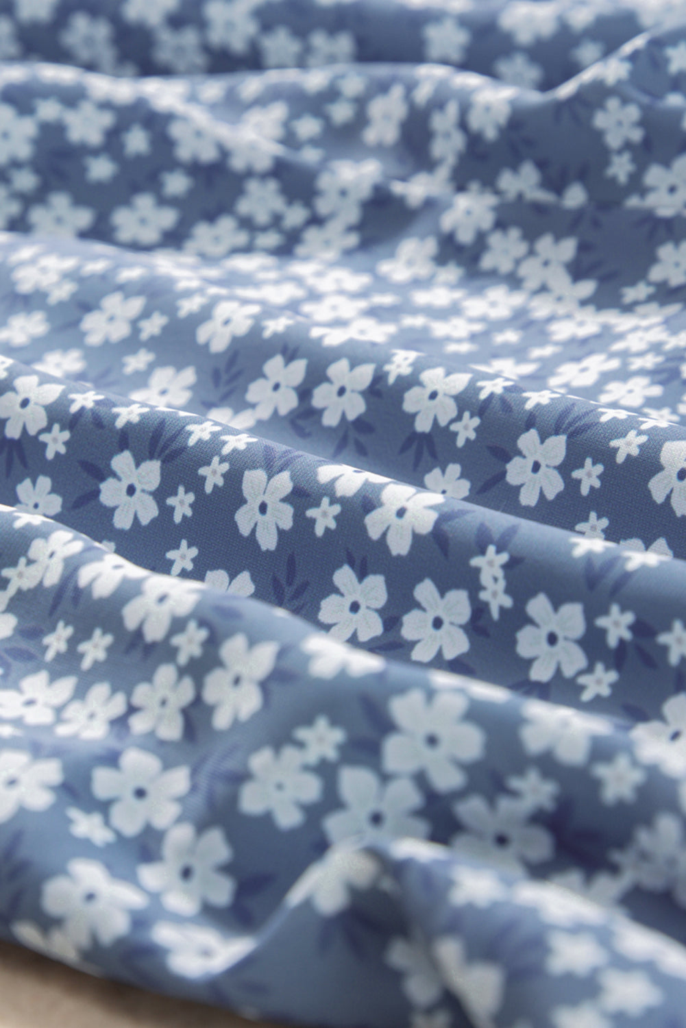 Blue fabric with white floral pattern