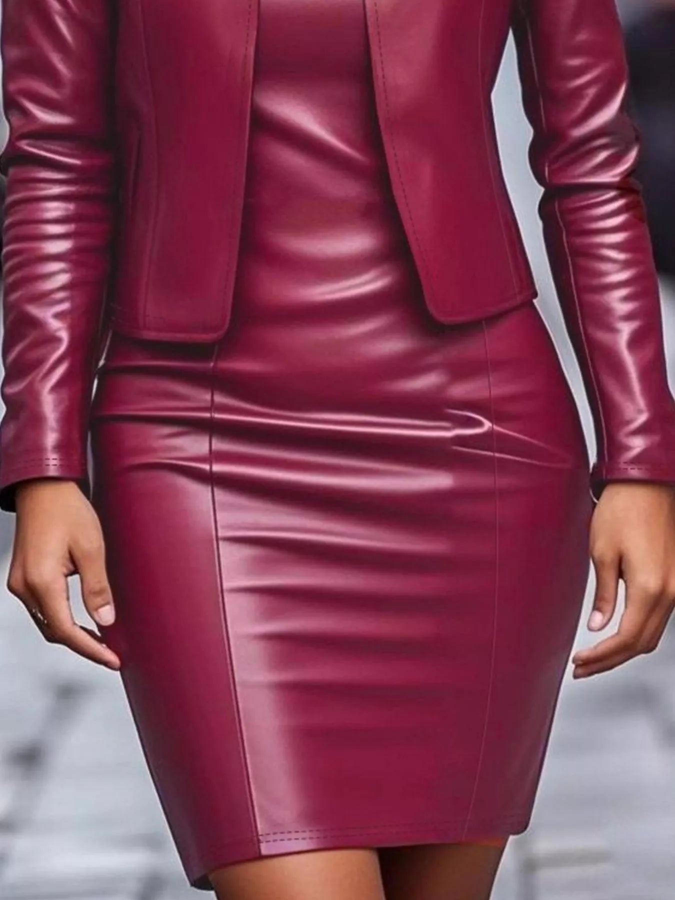 Maroon leather suit with jacket and skirt on a blurred background