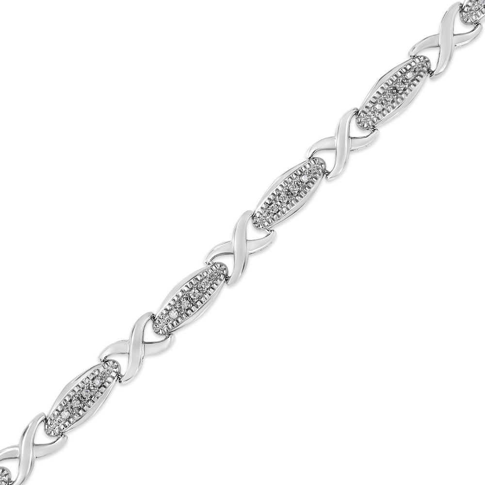 Silver bracelet with interwoven design on a white background