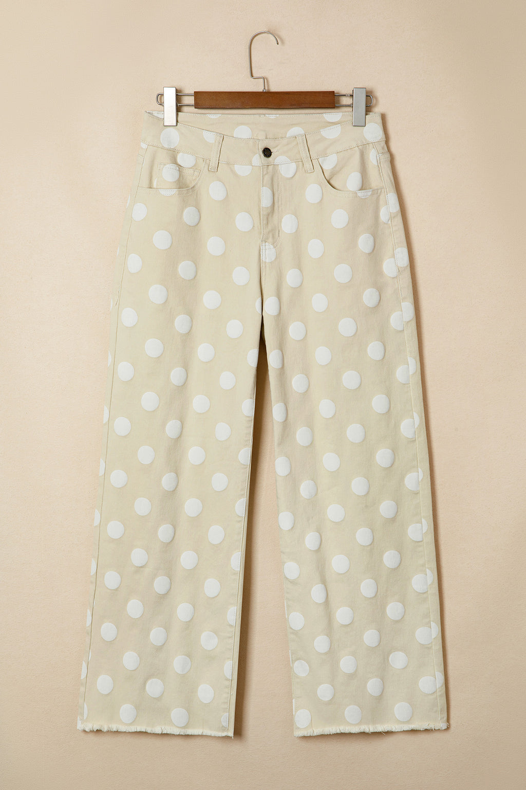 Beige pants with white polka dots on a beige background front 