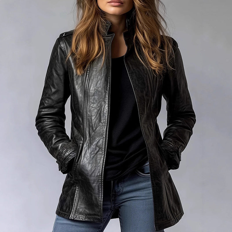 Person wearing a black leather jacket on a gray background