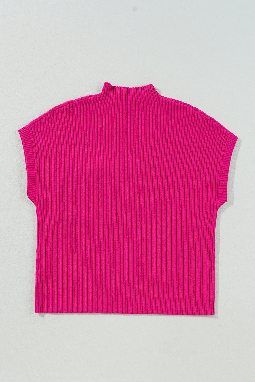 Pink ribbed sleeveless top on a light gray background