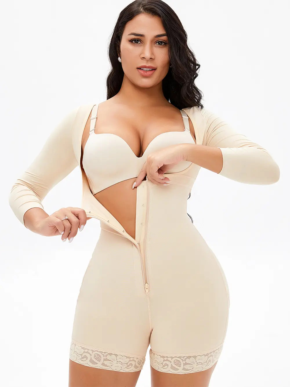 Woman wearing a beige shapewear romper on a white background