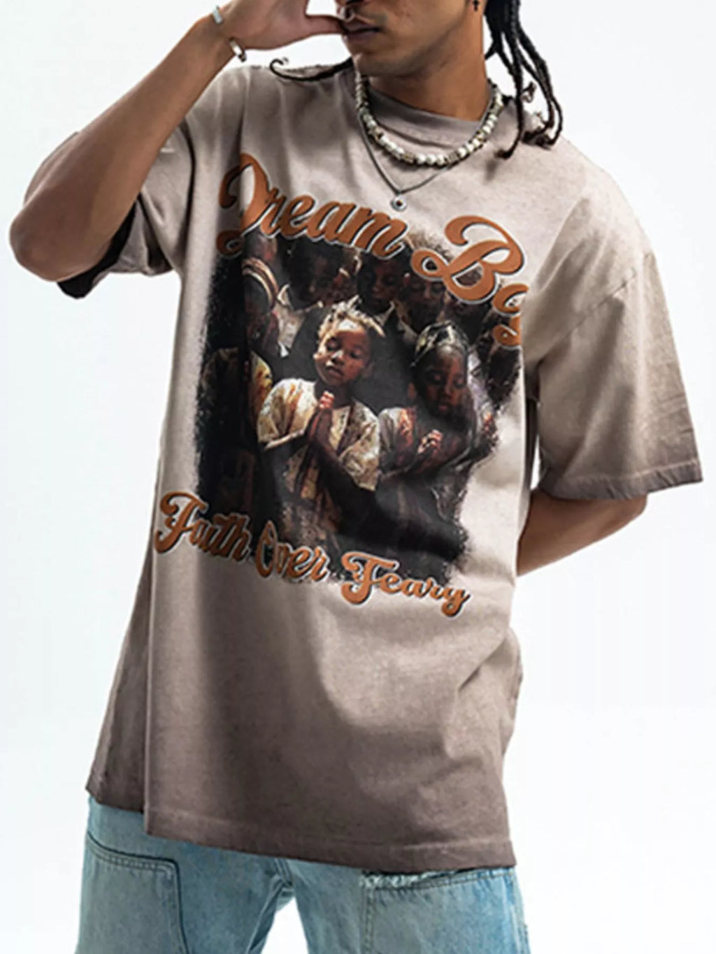 Model wear a Men's "Dream Boy" Graphic khaki  T-Shirt front view