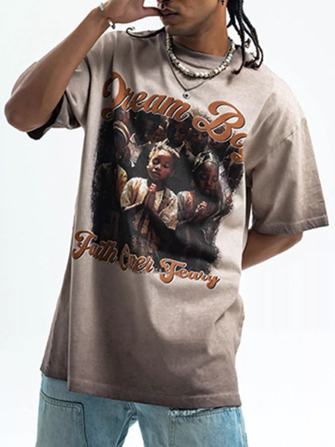Model wear a Men's "Dream Boy" Graphic khaki  T-Shirt front view
