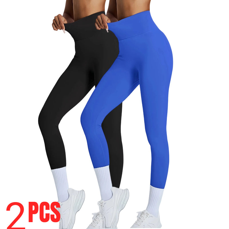 Person wearing black and blue leggings with white sneakers on a white background