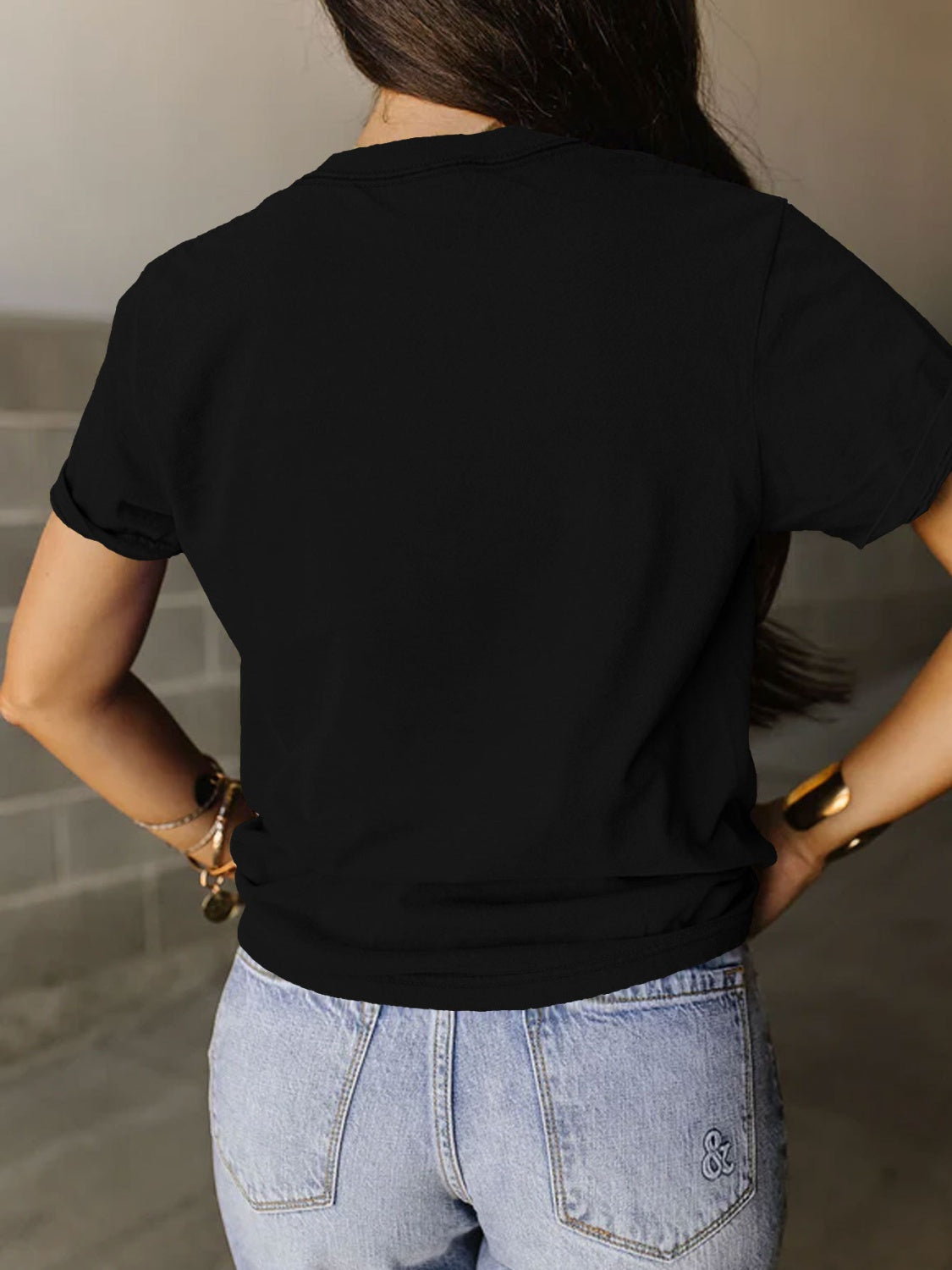 Back view of a Black Powered By The Black Women Before Me T-Shirt