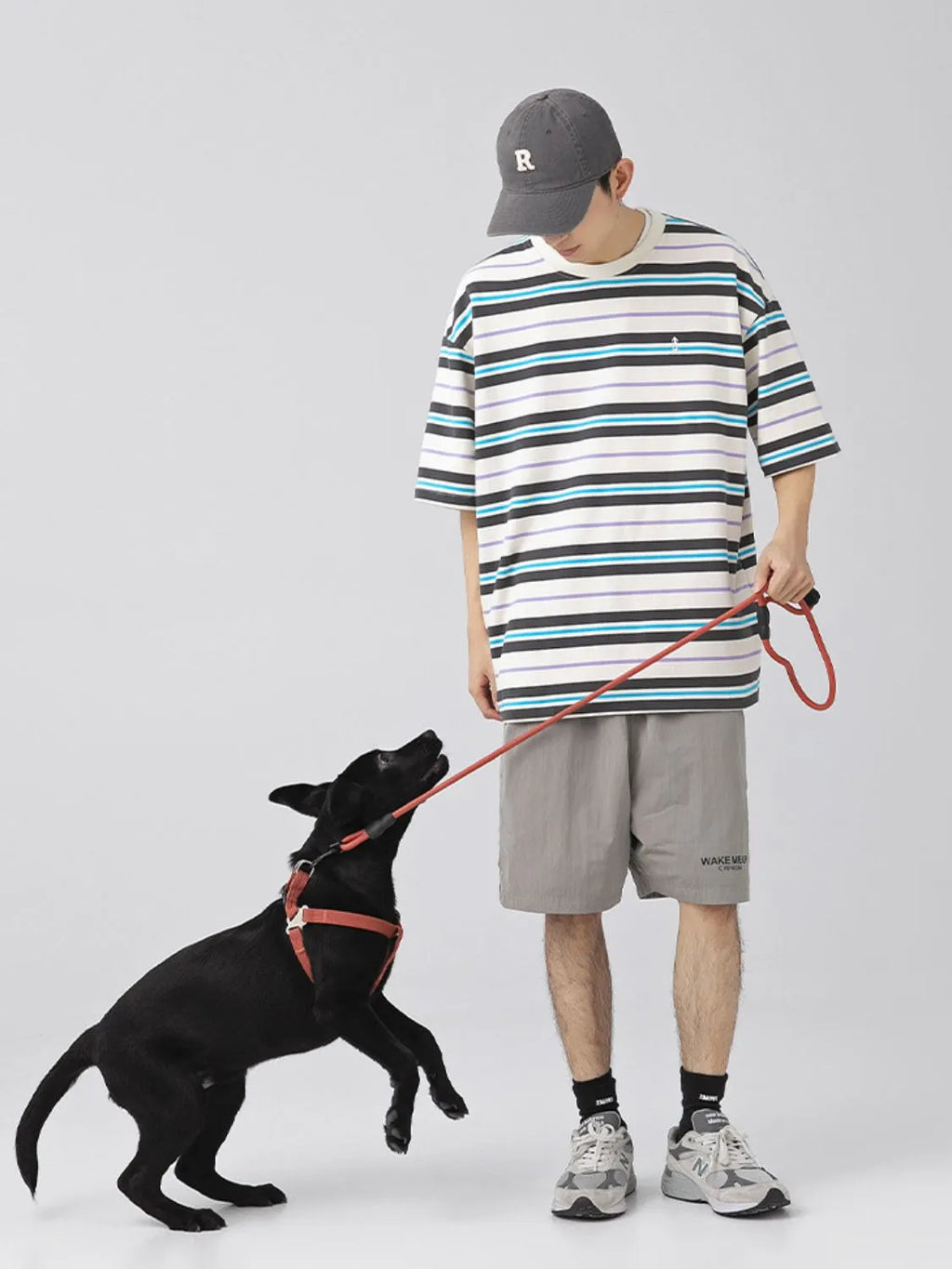 Male model wearing a light blue urban short sleeve stripe t-shirt front view
