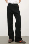 Model wearing a pair of Men's Black Relaxed Slim Fit Jeans