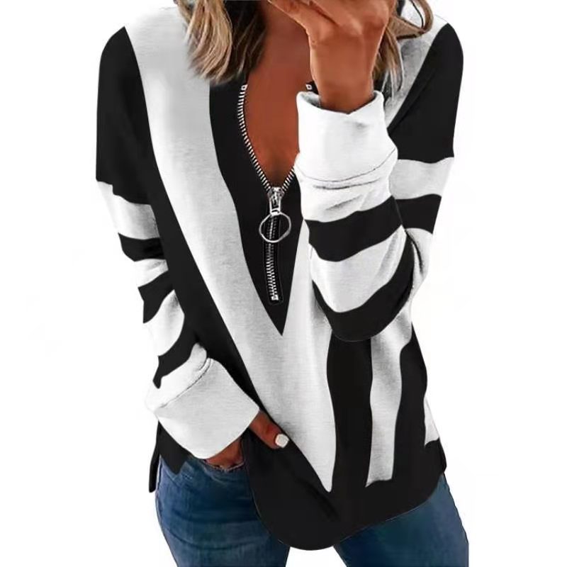 Black and white striped sweater with a zipper on a white background