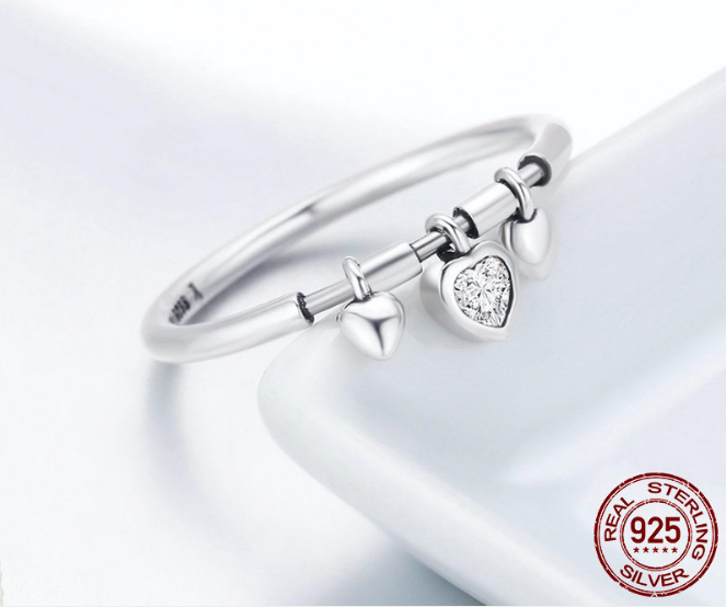 Experience pure elegance with our .925 sterling silver Heart Pendant Ring. This stunning piece is crafted with the highest quality silver, making it durable for everyday wear. Let the intricate heart design add a touch of dazzle to your outfit, perfect for any occasion