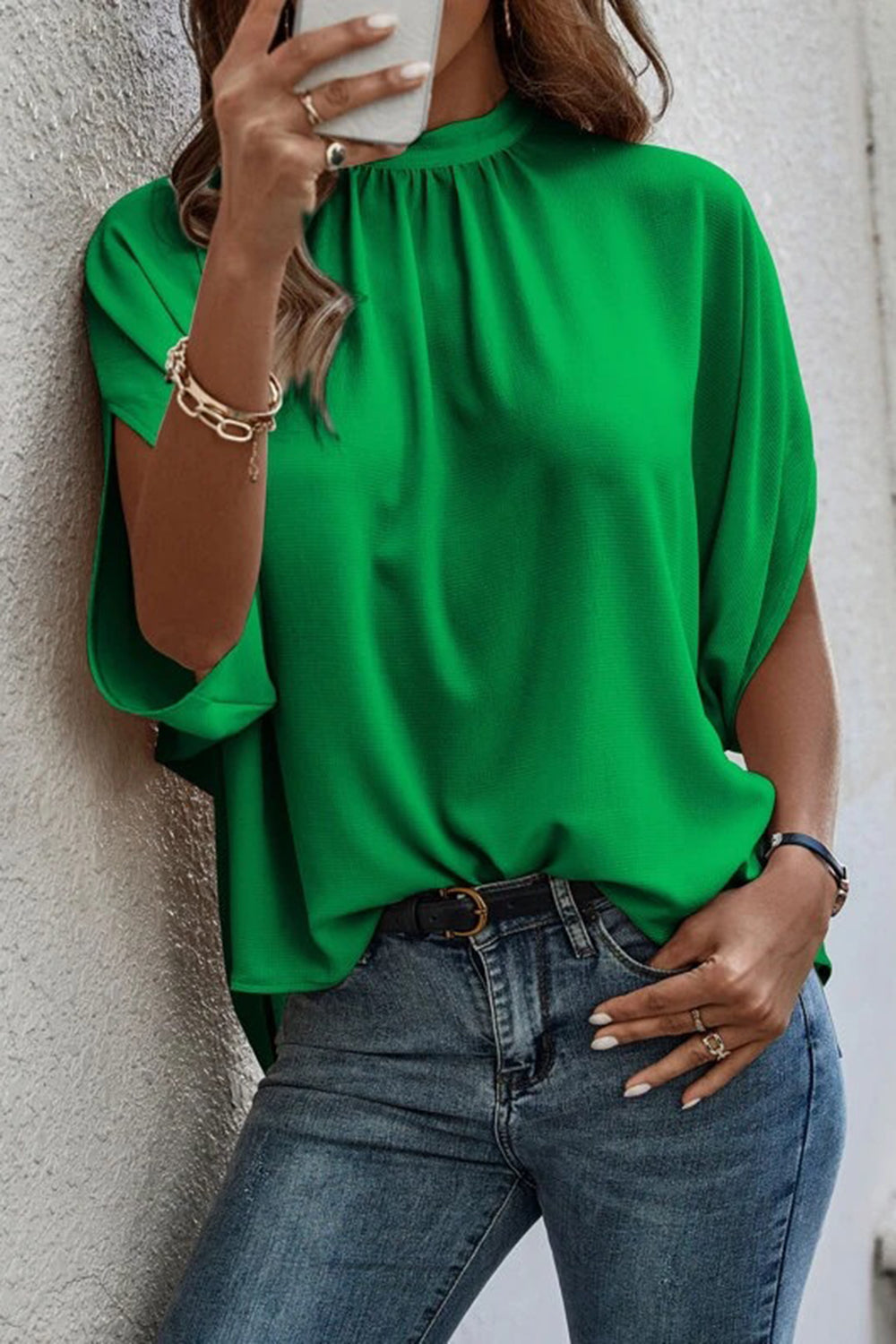 Model wearing an Exquisite Women's Green Tie Back Slit Half Sleeve Blouse