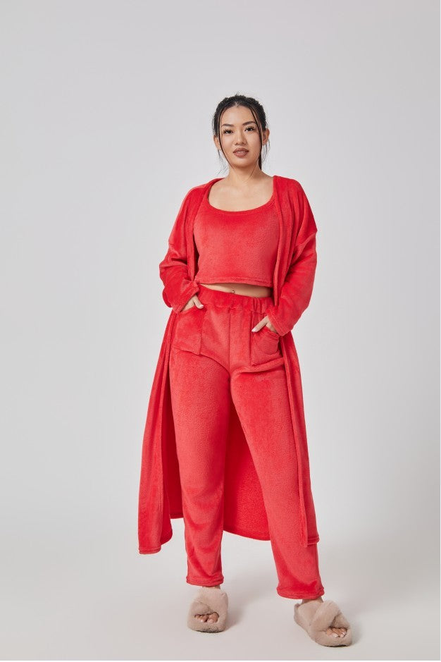 Person wearing a red outfit on a white background