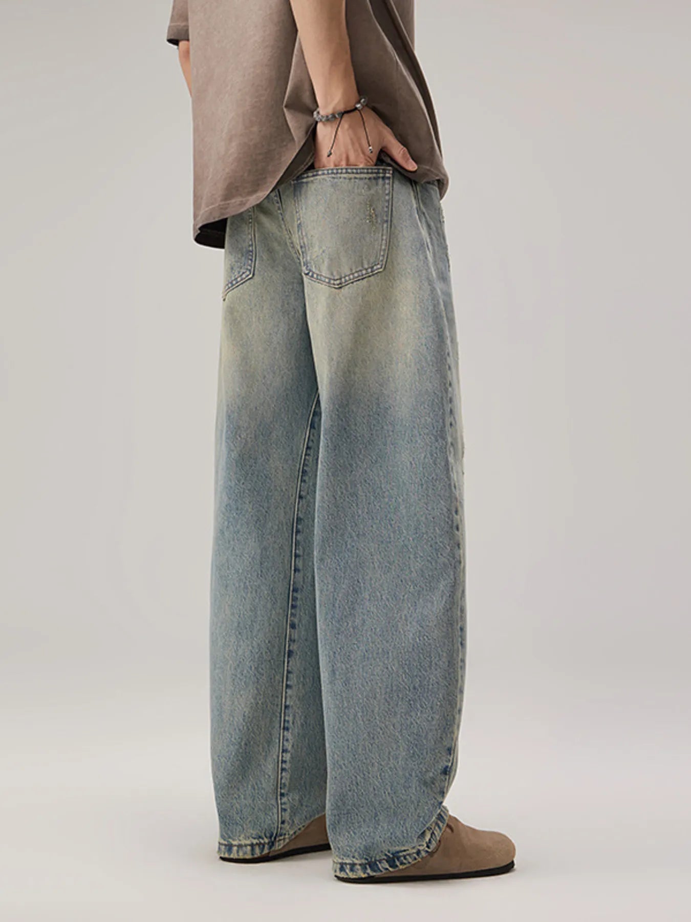 Men's Vintage Oversized Wash Wide Leg Jeans side angle view