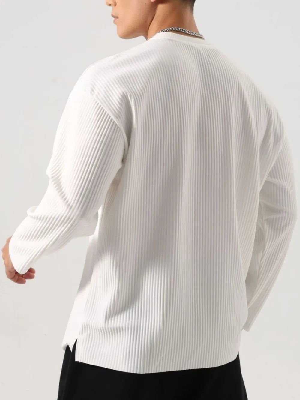 Person wearing a white Men's Basic Ribbed Round Neck Long Sleeve T-Shirt back view