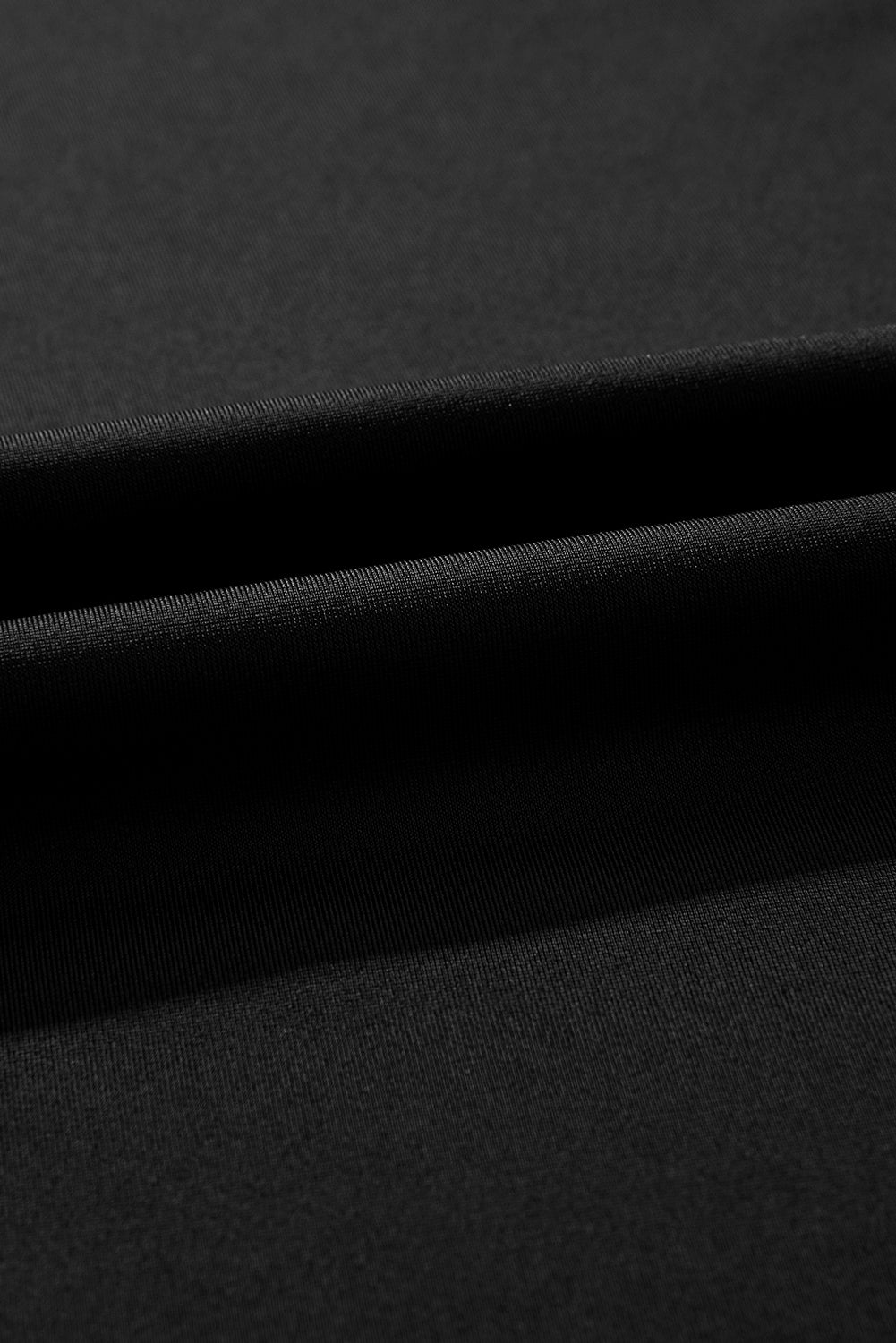Close-up of black fabric with a subtle texture