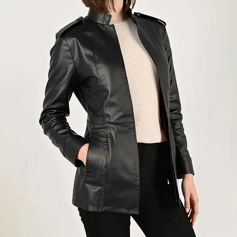 Black leather jacket worn by a person on a light gray background