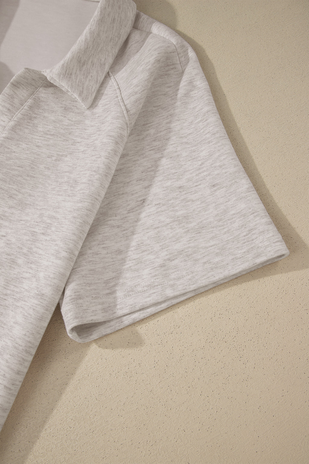 Gray sweatshirt on a beige background