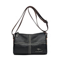 Black leather handbag with a visible brand logo on a white background