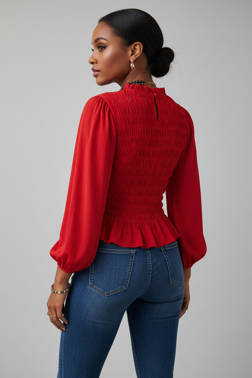 A woman shown from the back wearing a bright red Chic Smocked Ruffle Hem Boho Blouse with a smocked bodice and ruffled hem, paired with blue jeans, against a plain light gray studio background.