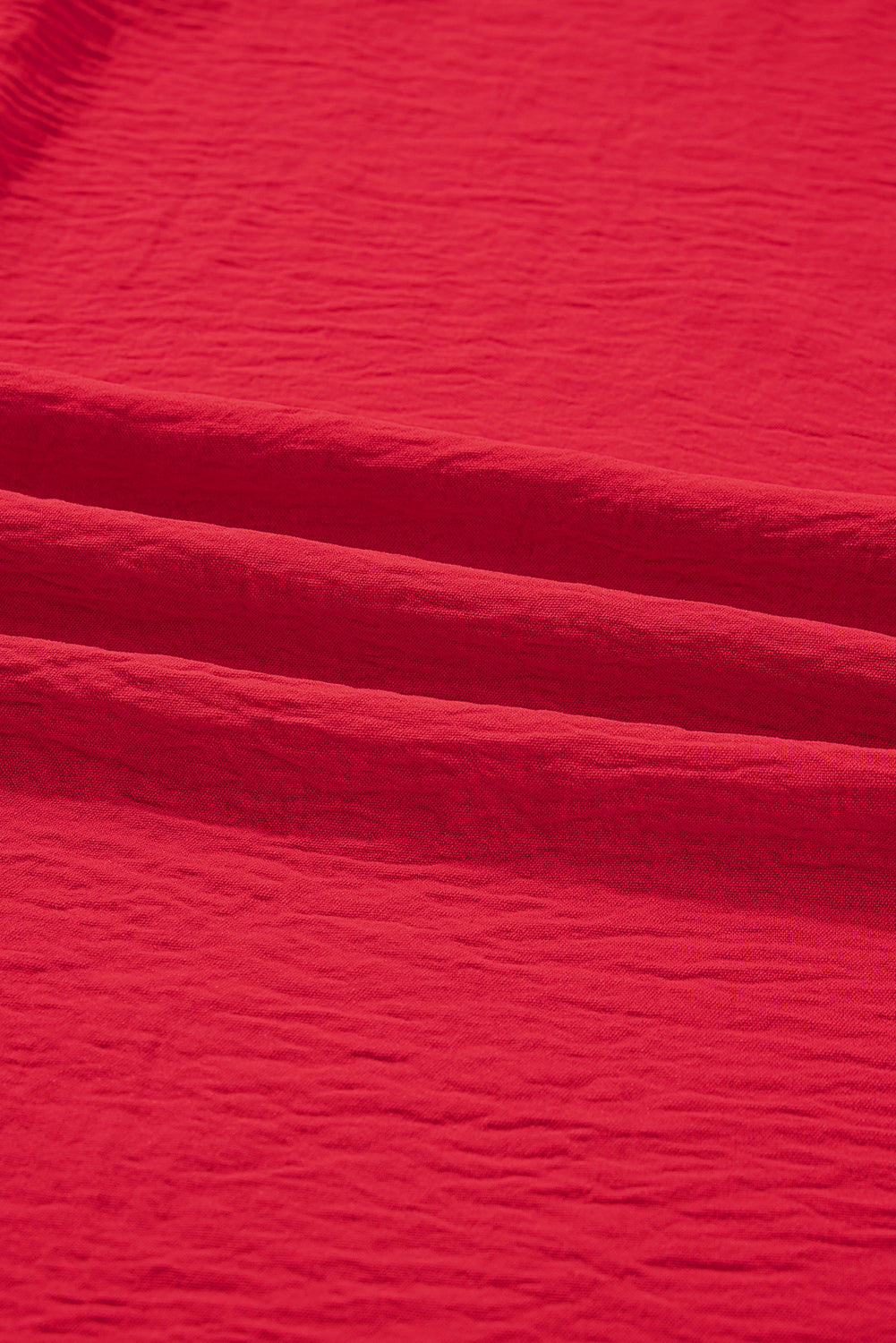 Close-up of red fabric with visible texture