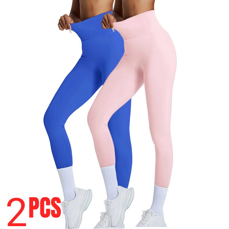 Two pairs of leggings, one blue and one pink, worn by a person on a white background.