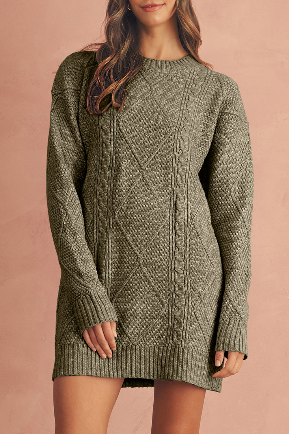 Person wearing a green cable knit sweater dress 