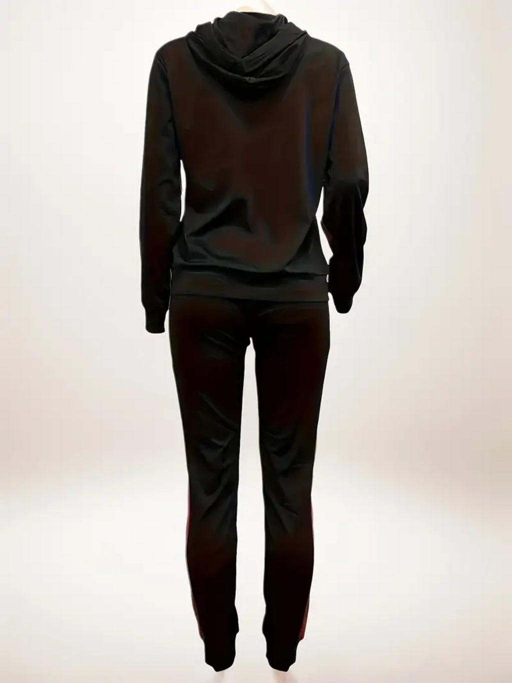 Dark gray hoodie and pants set on a white background