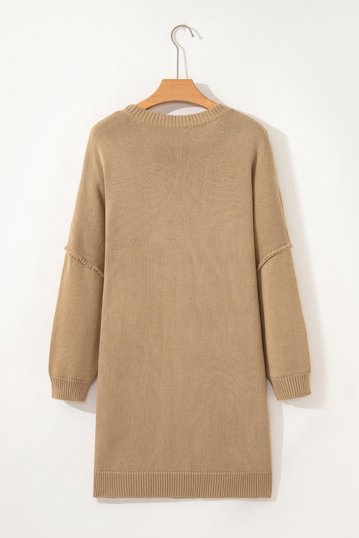 Women's Khaki Exposed Seam Mini Sweater Dress on a hanger back view
