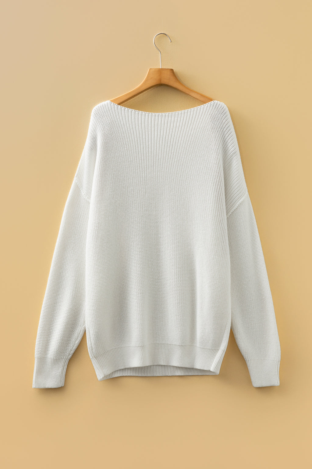 white Asymmetric Neck Drop Shoulder Baggy Sweater on a wooden hanger. Back view