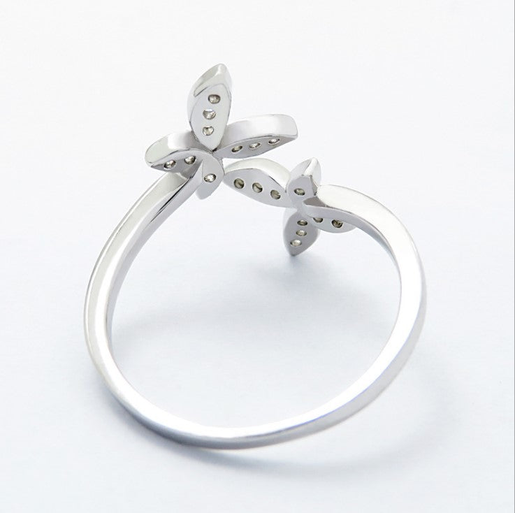 Fly into style with our Sterling Silver Open Butterfly Ring! Made with high-quality sterling silver, this ring features a playful and delicate butterfly design. Perfect for adding a touch of whimsy to any outfit. 