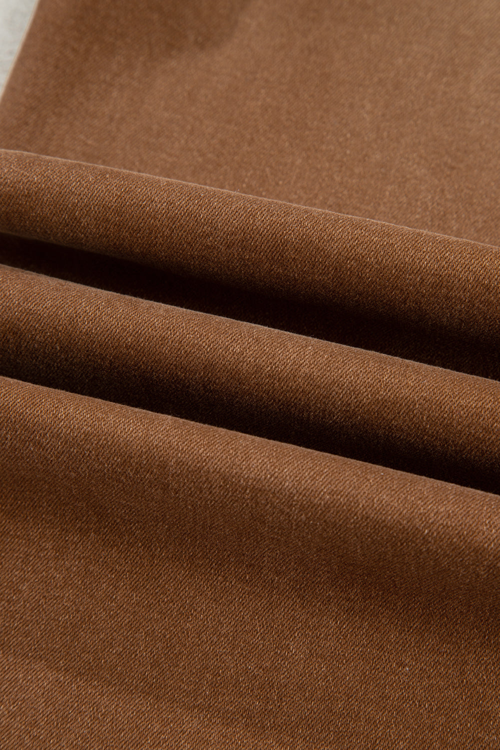 Close-up of brown fabric with visible texture