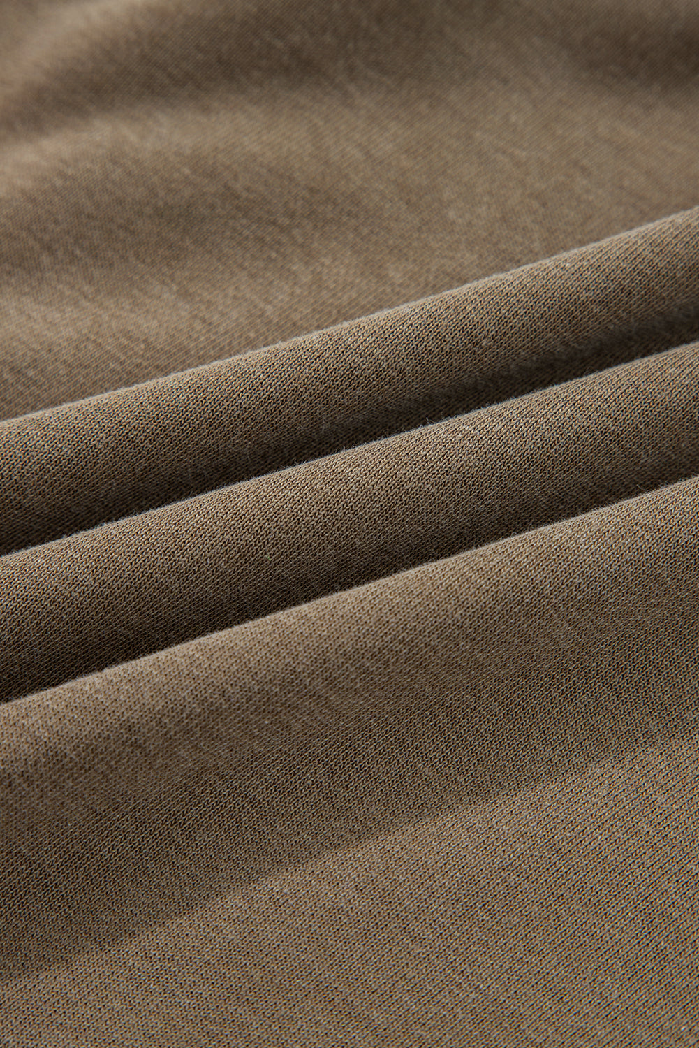Close-up of brown fabric with folds