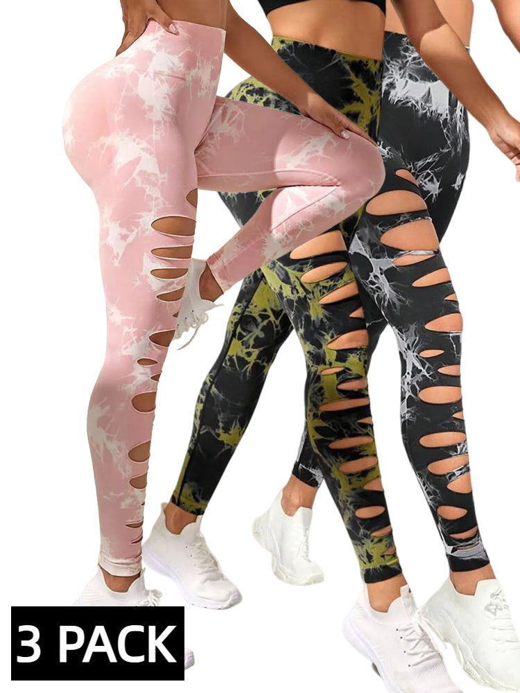 Three pairs of tie-dye leggings in pink, black, and green with distressed details, displayed on a white background.